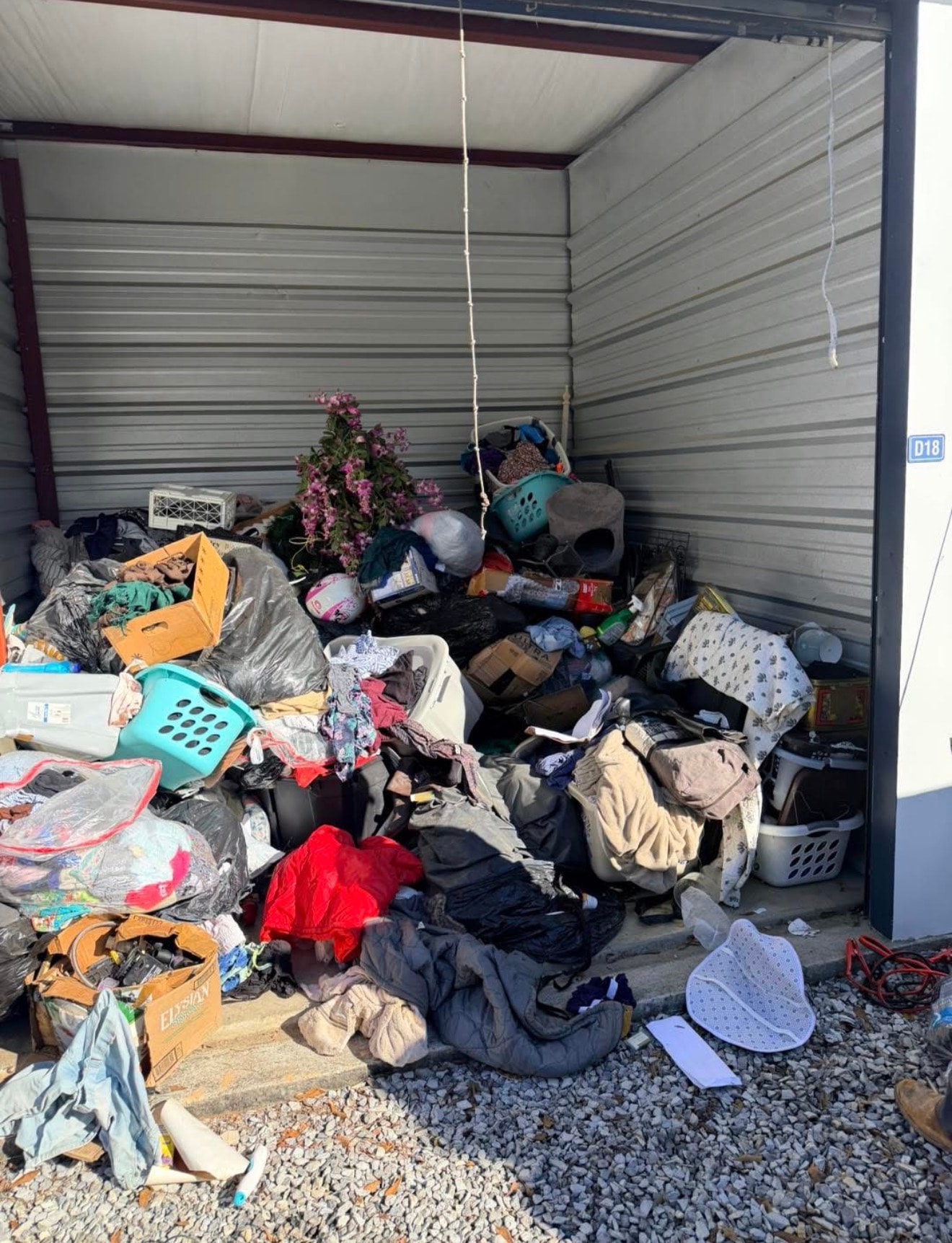 Cluttered storage unit before cleanout